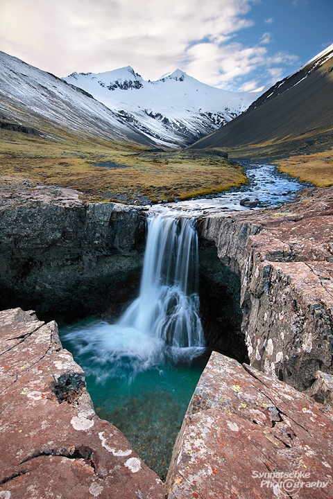 Waterfall in a remote valley in Southern Iceland