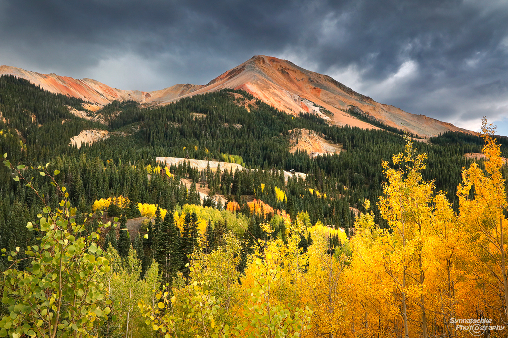 Red Mountain surrounded by fall foliage