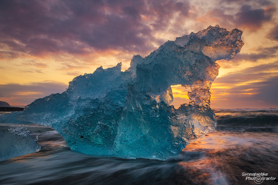 Blue iceberg at sunrise