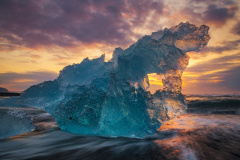 Blue iceberg at sunrise